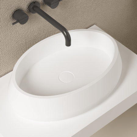 es un lavabo sobre encimera ovalado de solid surface de Zenon, se puede hacer en distintos colores diferentes